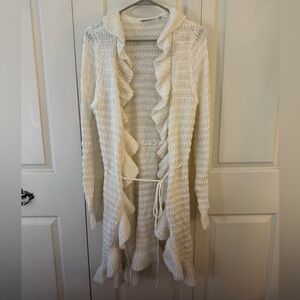 Excellent condition Versona white, ruffled tie sweater. Adorable!!